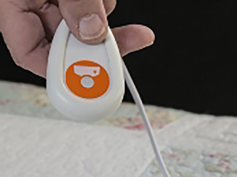 Bed alarm with hand