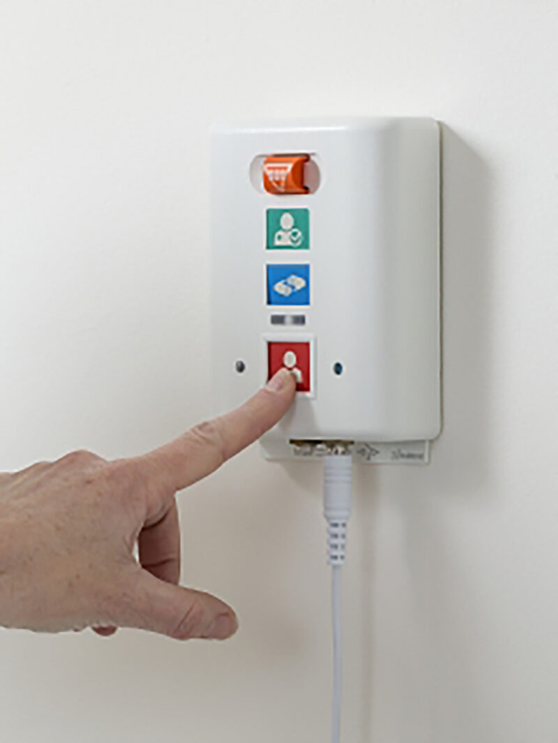 Wall unit on wall close up with hand 2 German Mkt 1