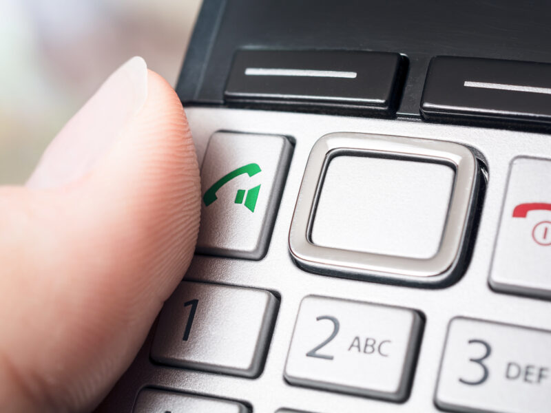 Male,Finger,On,The,Call,Button,Of,A,Wireless,Dect