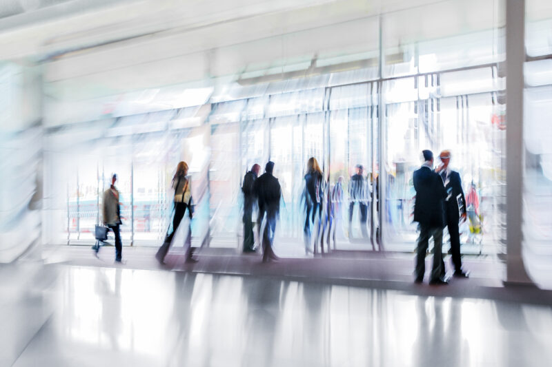 Abstract,Image,Of,People,In,The,Lobby,Of,A,Modern
