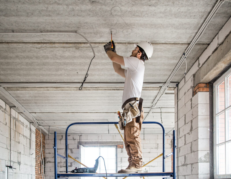 Electrician,Installer,With,A,Tool,In,His,Hands,,Working,With