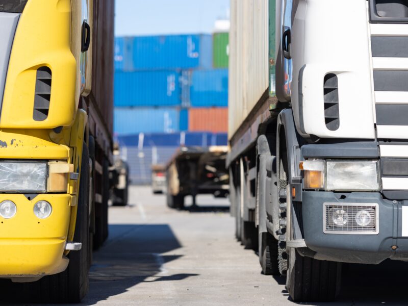 Trucks,Standing,On,The,Parking,Lot,By,The,Seaport,With