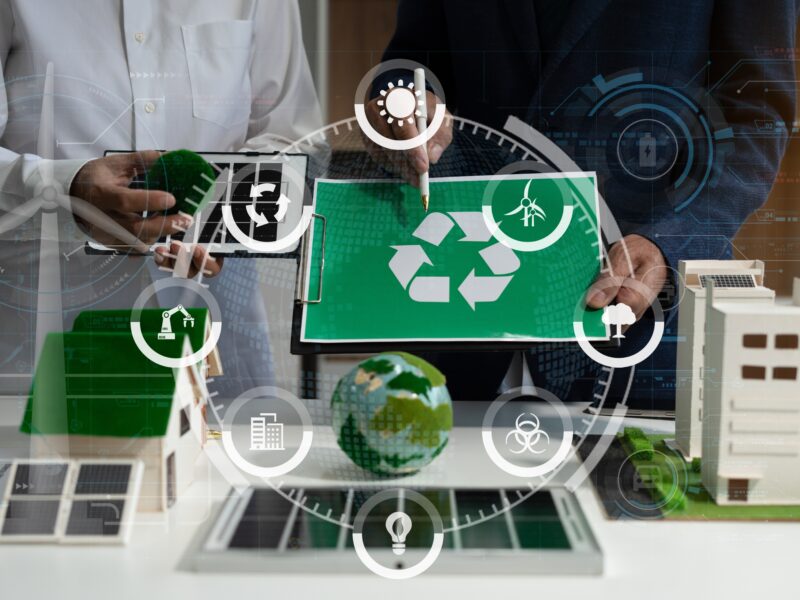 Two,Colleagues,Discussing,Data,Sustainable,Development,With,Renewable,Energy,Solutions,