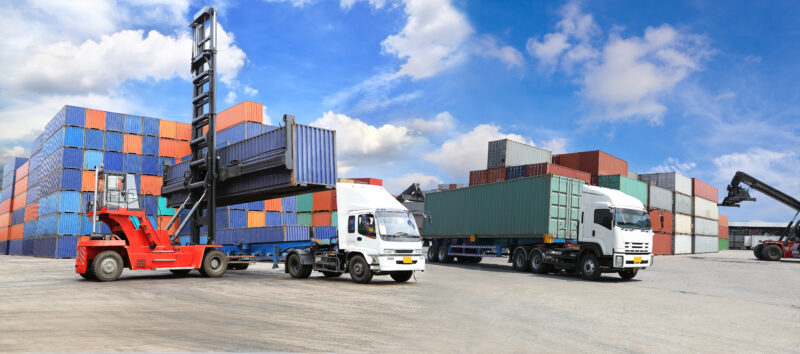 Forklift,Handling,The,Container,Box,At,Dockyard